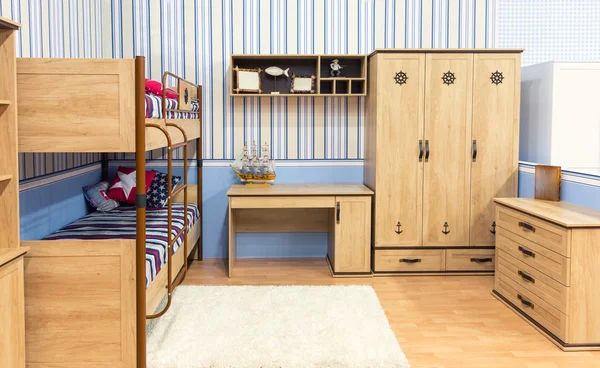 Bedroom with a bed cupboard and table — Stock Photo, Image