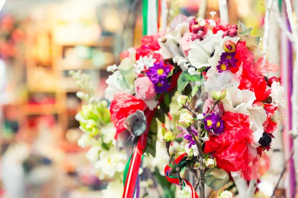 Beautiful bouquet of bright flowers in basket — Stock Photo, Image