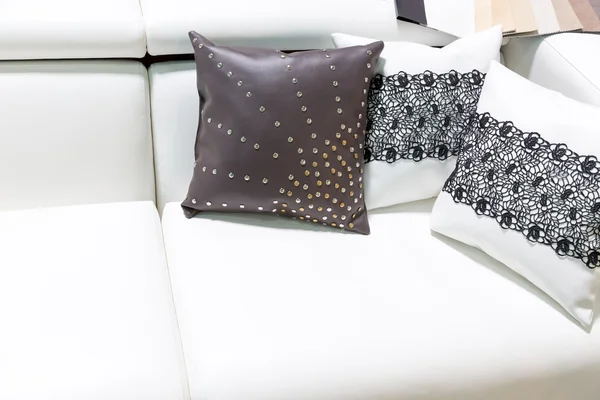 Leather pillows on the brown sofa — Stock Photo, Image