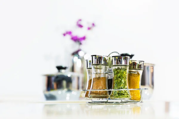 Powder spices in glass bottle jar — Stock Photo, Image