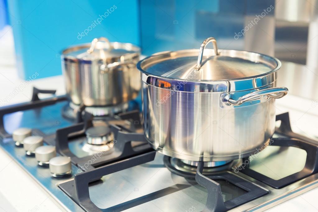 Stove with saucepan on the kitchen