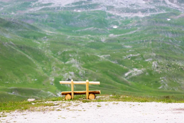 Bench in mountains — Stock Photo, Image