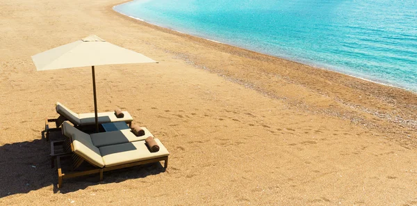 Canvas chairs on  beach — Stock Photo, Image