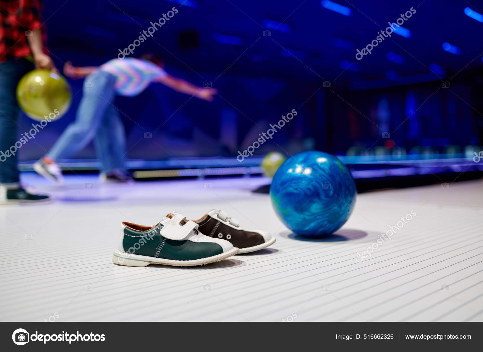 Bowling ball and house shoes on lane in club Stock Photo by NomadSoul1