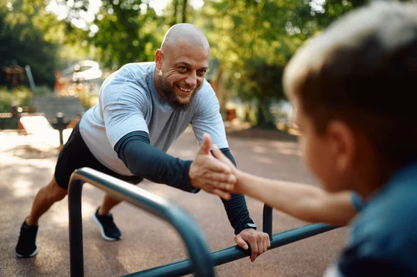 Cheerful father and son, sport training outdoors — Stock Photo, Image