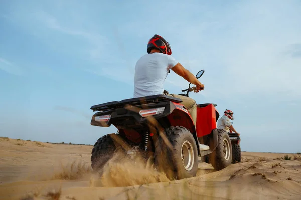 Two racers in helmets ride on atv, action view — Stock Photo, Image