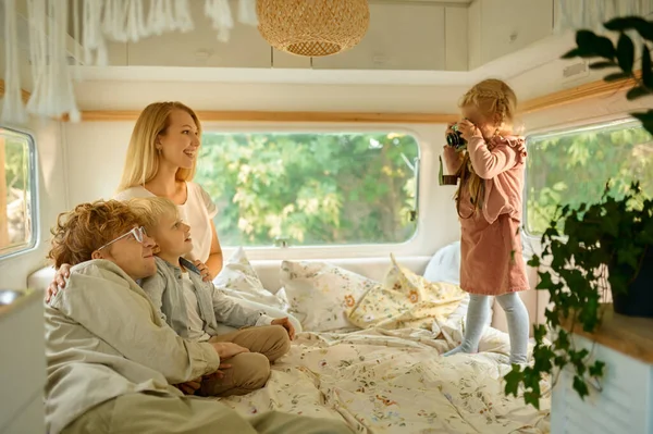 Happy campers family poses in motorhome, camping — Stock Photo, Image