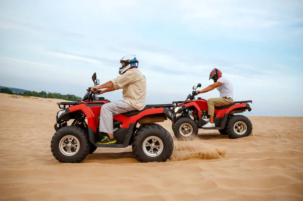 Two atv riders racing in desert sands — Stock Photo, Image