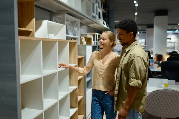 Couple choosing looking for home indoors decoration — Stockfoto