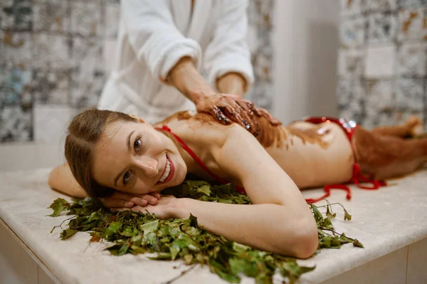 Young woman getting honey massage in sauna — Foto de Stock