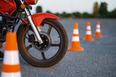 Motorbike and cones, motordrome, motorcycle school clipart
