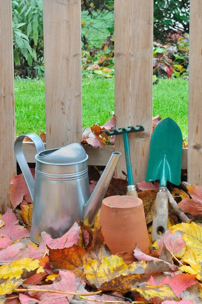 Gardening tools in fall garden — Stock Photo, Image