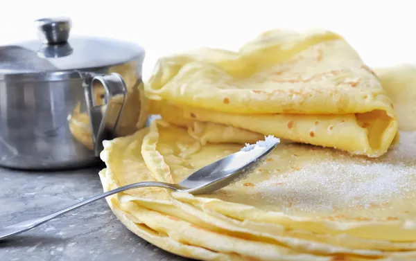 Tasting pancakes with sugar — Stock Photo, Image
