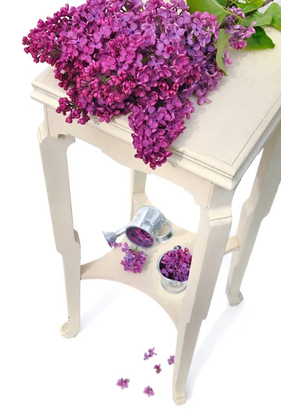 Lilas on little table — Stock Photo, Image