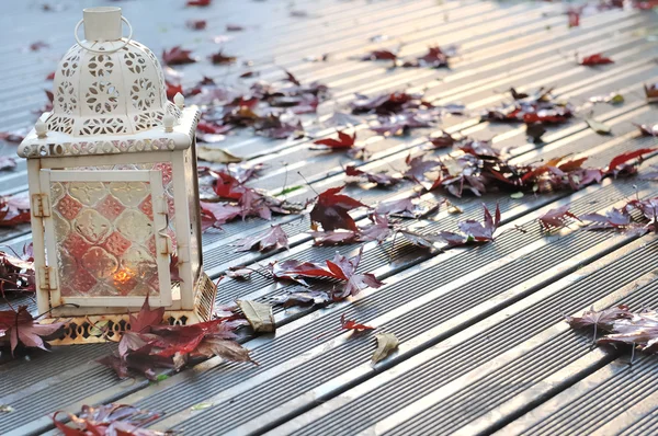 Lantern on a wet deck — Stock Photo, Image