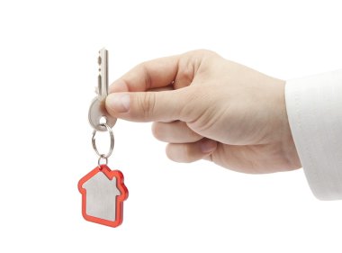 House key in hand with clipping path clipart