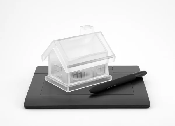 Design new house. Digital tablet and crystal house. — Stock Photo, Image