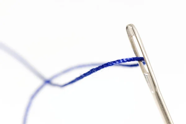 Needle and thread on white background — Stock Photo, Image