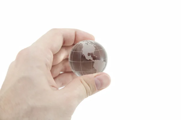 Crystal globe in de hand met uitknippad — Stockfoto