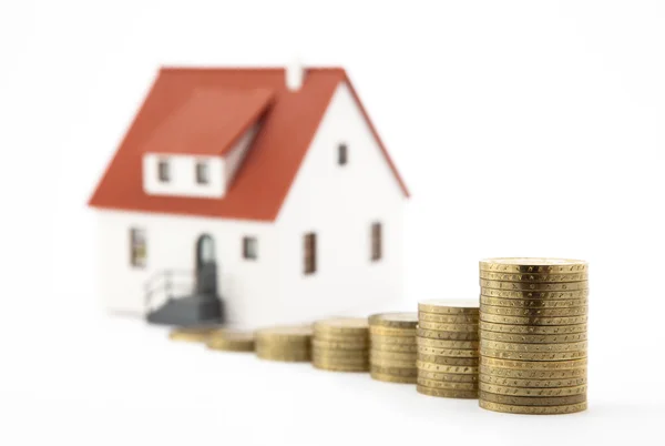 Huis en geld over Wit — Stockfoto