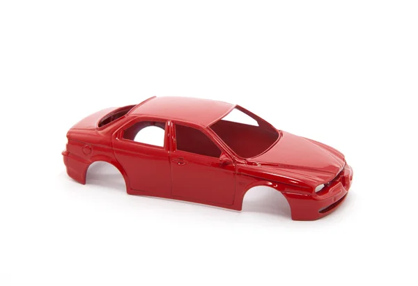 Rosso giocattolo auto corpo su sfondo bianco — Foto Stock