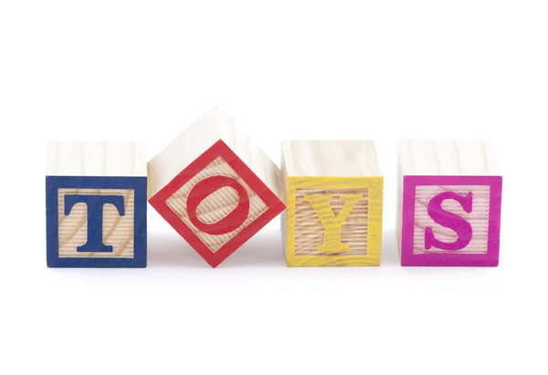 Alfabet blokken spelling van het woord speelgoed met uitknippad — Stockfoto
