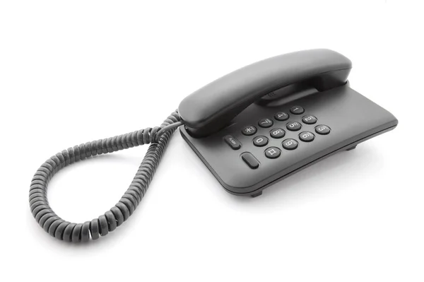 Черный офисный телефон с мягкой тенью на белом — стоковое фото