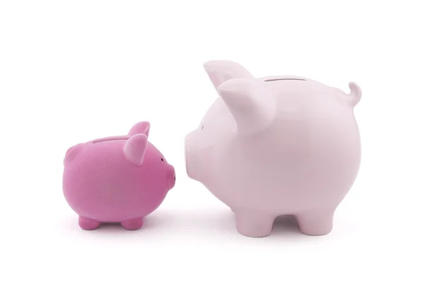 Twee piggy banken met uitknippad — Stockfoto