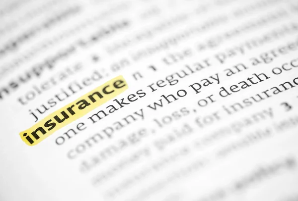 The word insurance highlighted in a dictionary — Stock Photo, Image