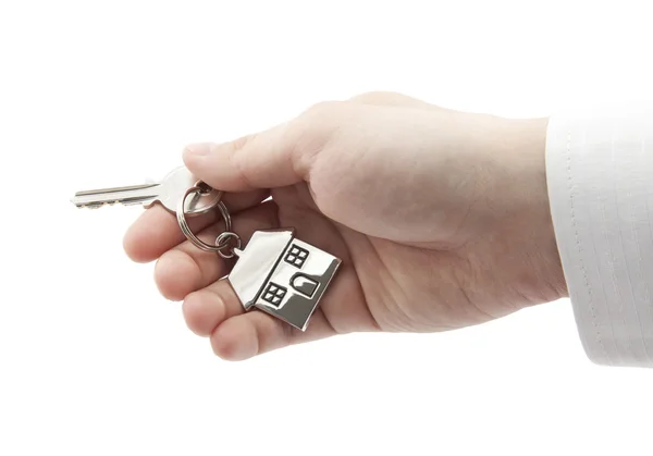 House key in hand with clipping path — Stock Photo, Image