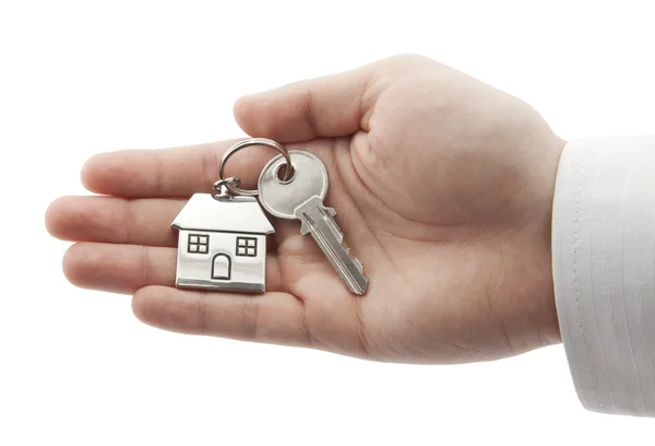 House key in hand with clipping path — Stock Photo, Image