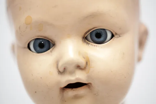 Child's baby doll face — Stock Photo, Image