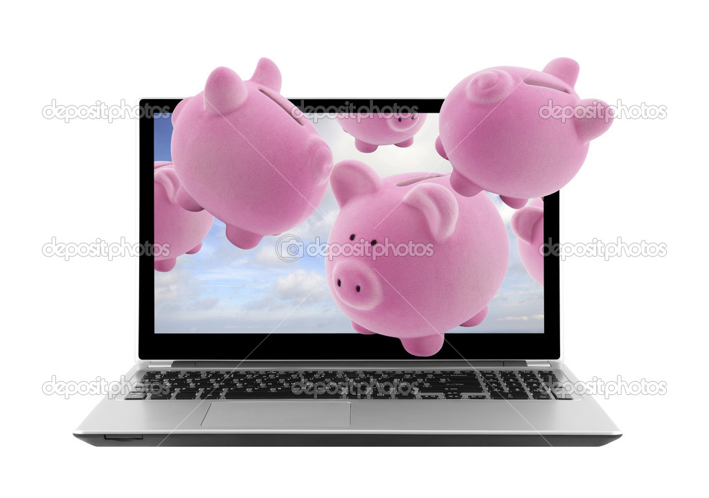 Laptop and piggy banks isolated on white