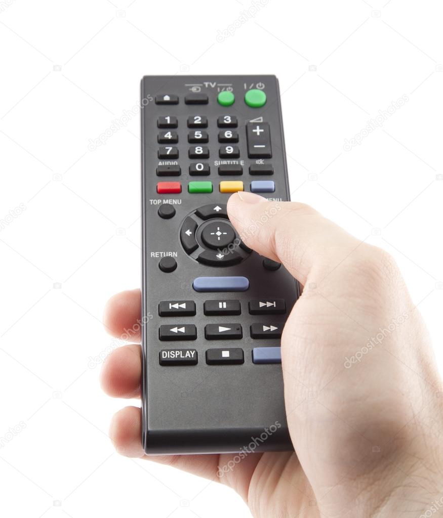 Hand pressing remote control isolated on white