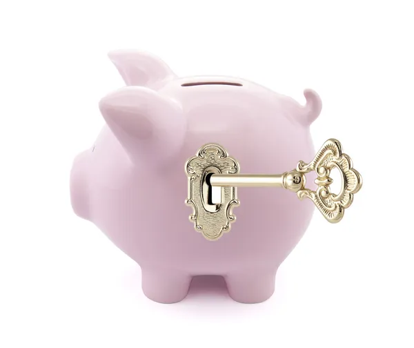 Piggy bank with golden key — Stock Photo, Image