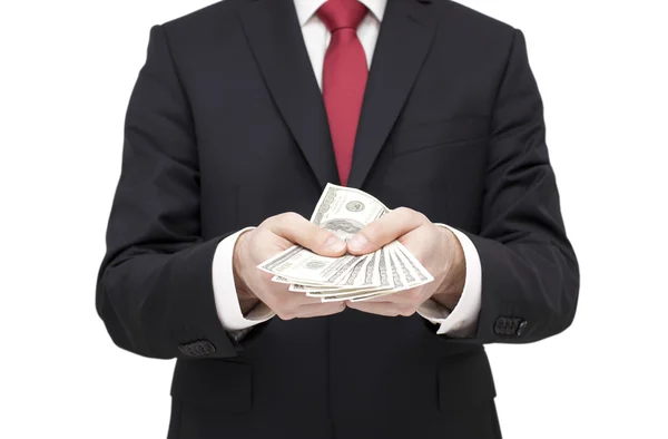 Businessman holding dollars. Clipping path included. — Stock Photo, Image