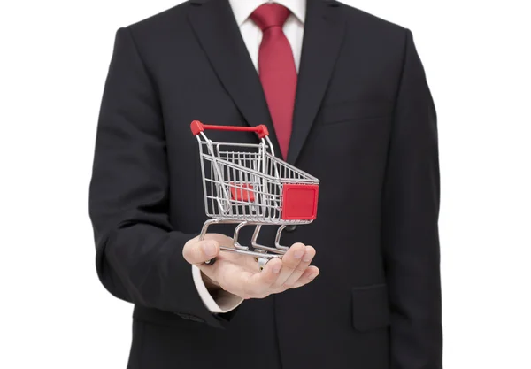 Shopping cart in businessman hand with clipping path — Stock Photo, Image