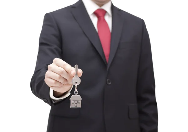 Dom klucz w ręku biznesmen z ścieżki przycinającej — Zdjęcie stockowe
