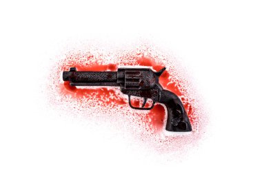 Old black revolver gun in red blood on white background