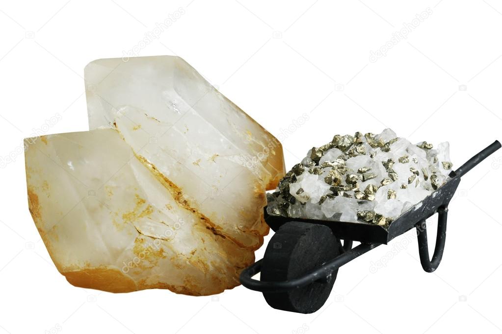 Crystal of quartz and souvenir - a wheelbarrow with ore