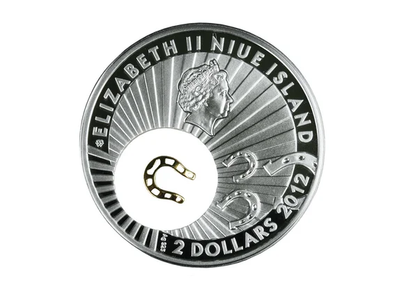 Münze Silber mit einem goldenen Hufeisen — Stockfoto