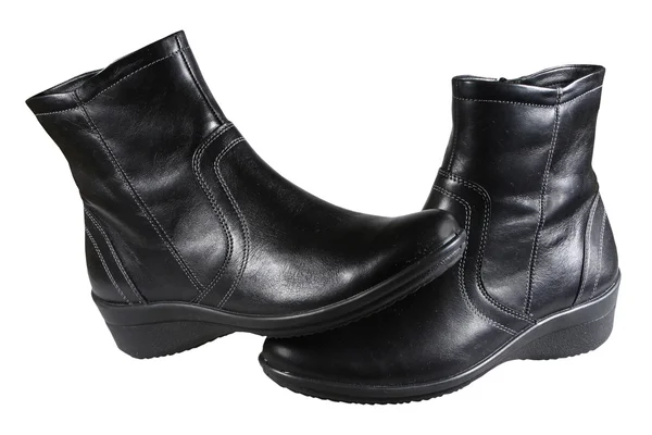 Vrouwelijke leren zwarte laarzen — Stockfoto