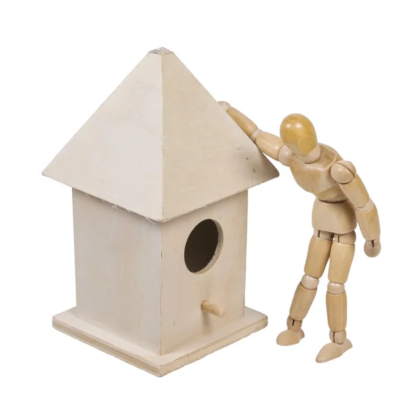 Peering into a Birdhouse with Roof and a Peg for a Porch Stock Photo