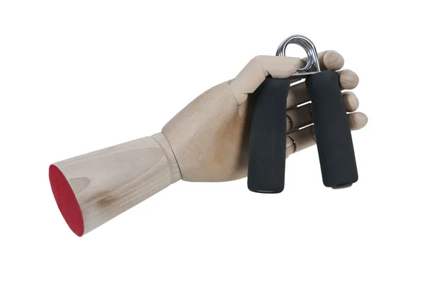 Mão de madeira que prende o exercitador de aperto de mão — Fotografia de Stock