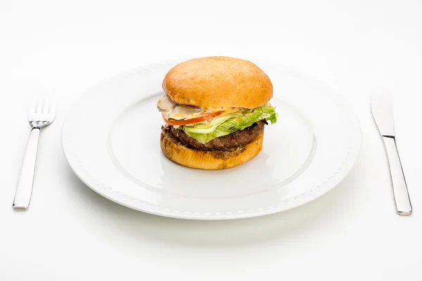 Burger on plate — Stock Photo, Image