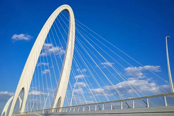 modern bridge building architecture in beijing with cloudy blue sky