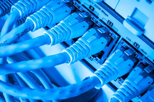 Network hub and patch cables — Stock Photo, Image