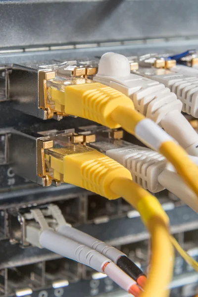 Network hub and patch cables — Stock Photo, Image