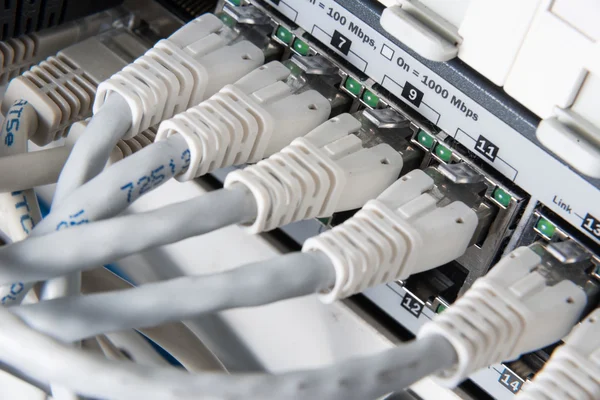 Network hub and patch cables — Stock Photo, Image