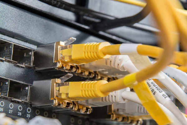 Network hub and patch cables — Stock Photo, Image